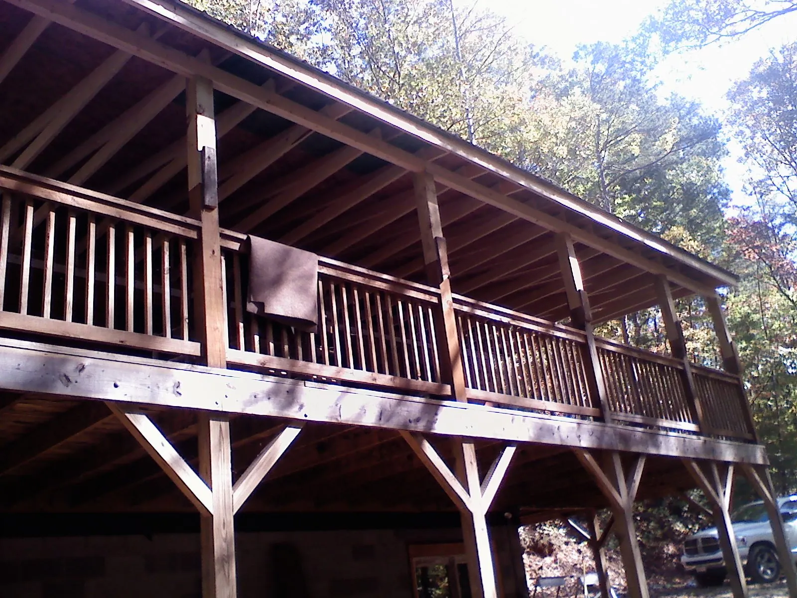 Timber framing under a new elevated porch and deck — Roof Leak Repair in Adrian by Roofing Brothers